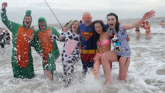 Swimmers brave the North Sea in the New Year's Day dip at Whitley Bay